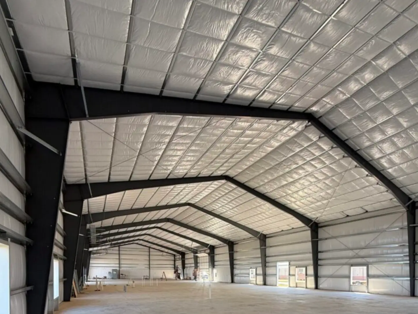 Empty industrial steel warehouse with insulated ceiling